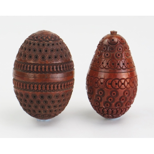 196 - A carved coquilla nut of egg -shaped outline with banded geometric decoration, 7cm long together wit... 