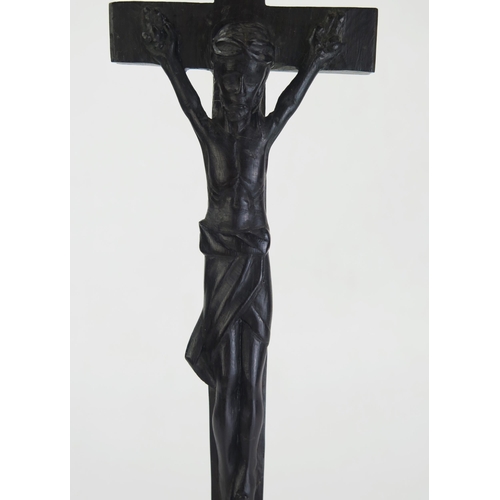 197 - A carved hardwood crucifix, with integral carved figure of Christ, 34cm high.