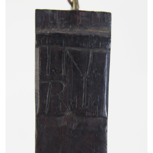 197 - A carved hardwood crucifix, with integral carved figure of Christ, 34cm high.