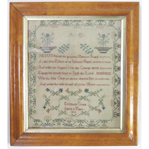 199 - A William IV needlework sampler with central verse, angels, flowering shrubs, enclosed by a floral m... 