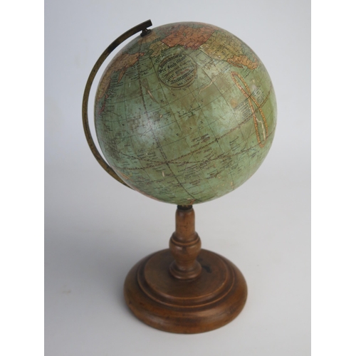 202 - A Johnson's six inch terrestrial globe, on brass frame and turned  wood circular base, overall heigh... 