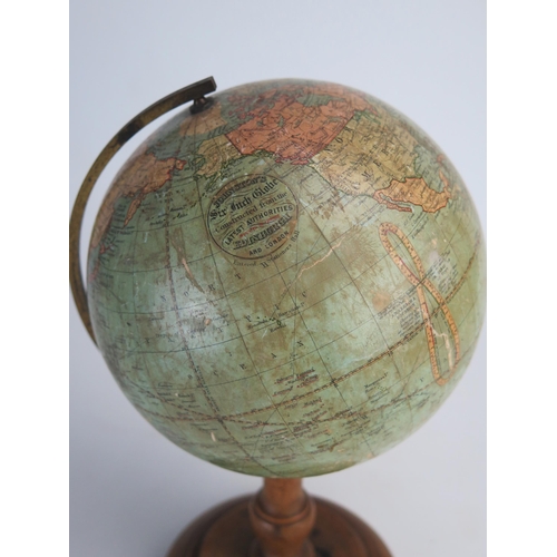 202 - A Johnson's six inch terrestrial globe, on brass frame and turned  wood circular base, overall heigh... 