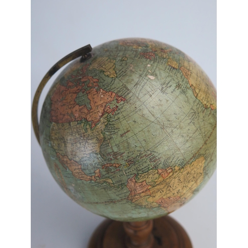 202 - A Johnson's six inch terrestrial globe, on brass frame and turned  wood circular base, overall heigh... 