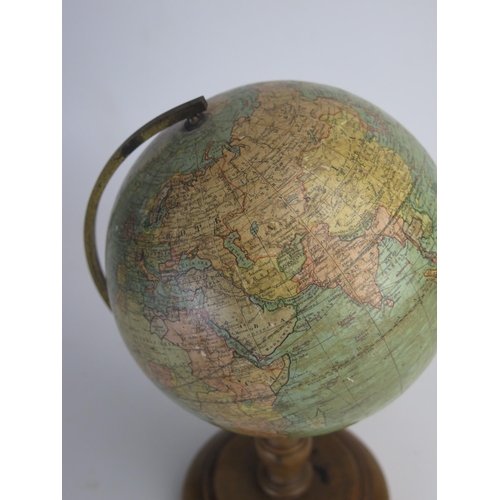 202 - A Johnson's six inch terrestrial globe, on brass frame and turned  wood circular base, overall heigh... 