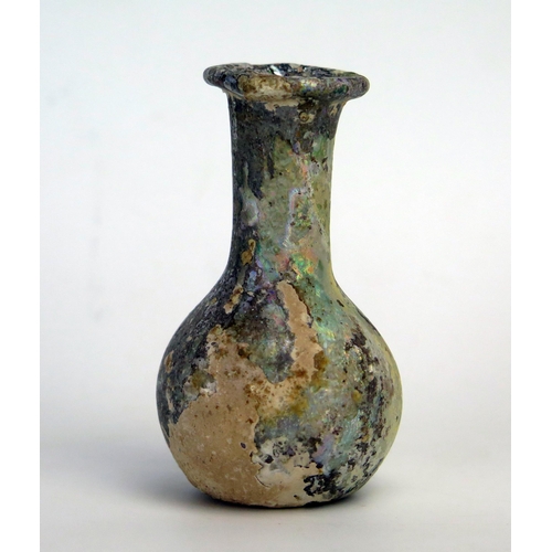 206 - A Roman glass cosmetic bottle, of ovoid form with flared long neck and folded rim, 8cm high 2nd - 3r... 