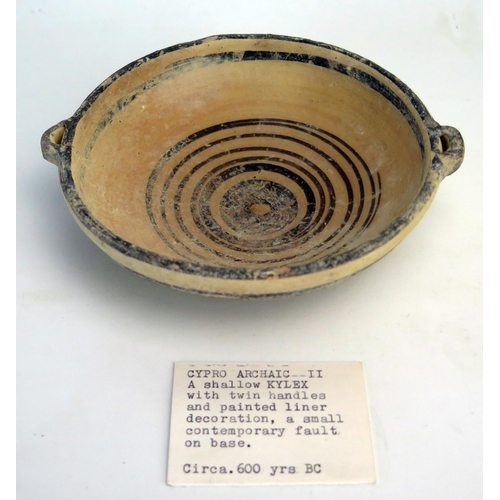 207 - A Cypro  archaic period kylex form bowl, probably Greek, with loop handles to the sides, plain bande... 