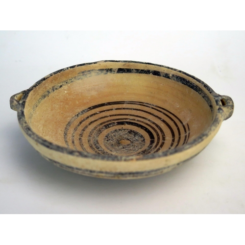 207 - A Cypro  archaic period kylex form bowl, probably Greek, with loop handles to the sides, plain bande... 