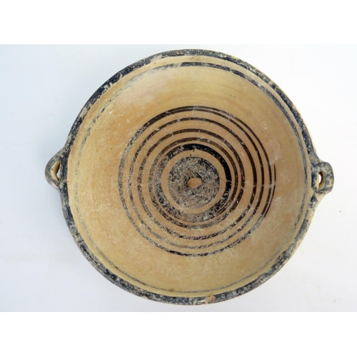 207 - A Cypro  archaic period kylex form bowl, probably Greek, with loop handles to the sides, plain bande... 