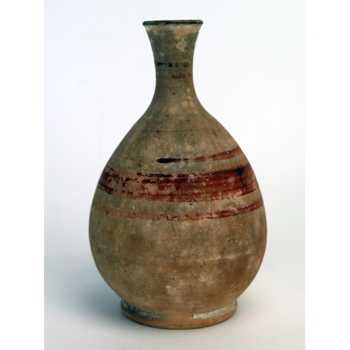 208 - An ancient Cyprian vase, of ovoid form with short flared neck and spout, with banded decoration, on ... 