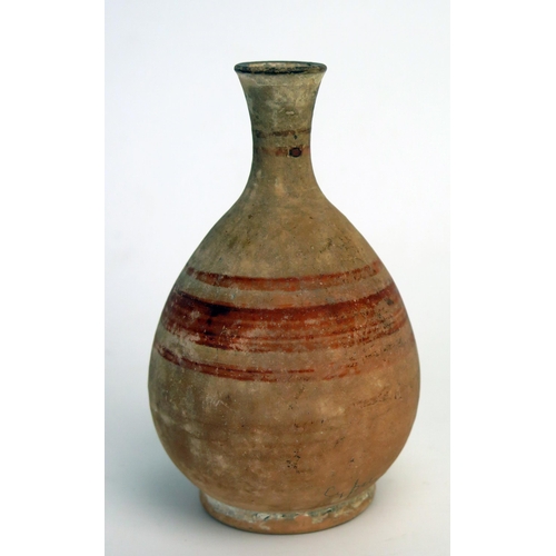 208 - An ancient Cyprian vase, of ovoid form with short flared neck and spout, with banded decoration, on ... 