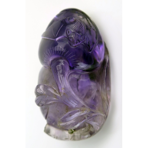 209 - A Chinese carved amethyst pendant in the form of a gourd and bat, 4cm long.