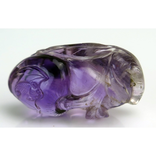 209 - A Chinese carved amethyst pendant in the form of a gourd and bat, 4cm long.