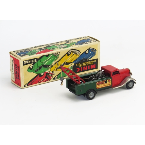 256 - Tri-ang Minic Tinplate Clockwork Breakdown Lorry with red cab and crane arm, dark green rear, chrome... 