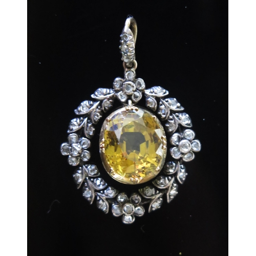 26 - An Antique Yellow Topaz and Rose Cut Diamond Wreath Pendant in a precious yellow and white metal set... 