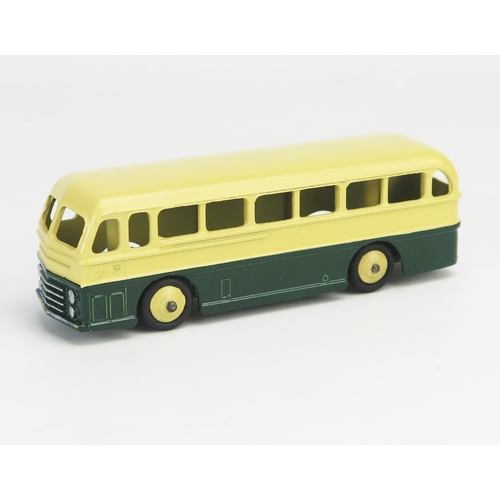 273 - Dinky 29H (282) Duple Roadmaster Leyland Royal Tiger Coach in cream/dark green with cream ridged hub... 