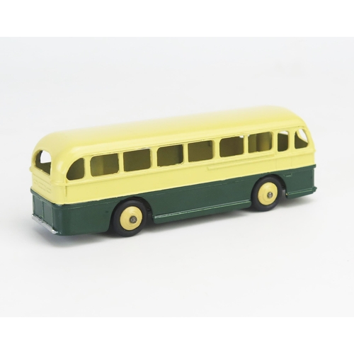 273 - Dinky 29H (282) Duple Roadmaster Leyland Royal Tiger Coach in cream/dark green with cream ridged hub... 