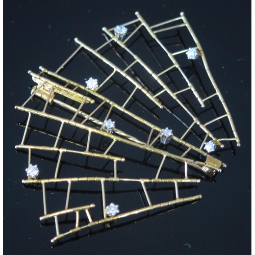 28 - * A Modernist 18ct Gold and Diamond Articulated Fan Shaped Brooch hinged at each vertical axis, set ... 