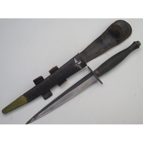 302 - A  Fairbairn Sykes third pattern fighting knife with 17.5cm double edged blade, with ribbed grip, co... 