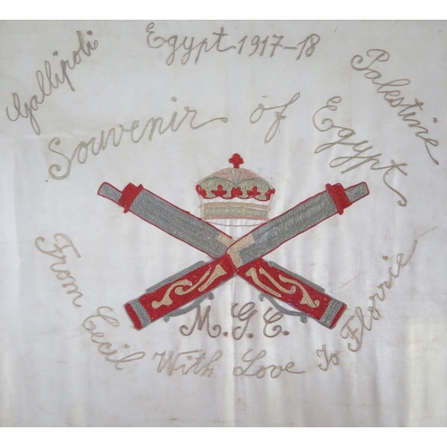 306A - A Machine Gun Corps silkwork souvenir of Egypt, with MGC Regimental badge, 