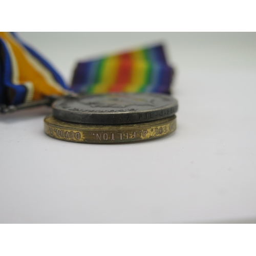 313 - A World War I Pair to 24637. Pte. J Felton. Devon R., War and Victory Medals together with cap badge... 