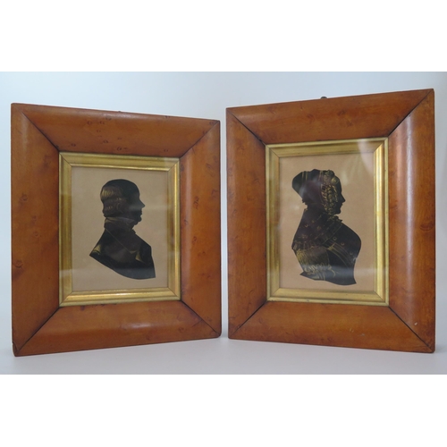 328 - A pair of Regency period silhouettes of a lady and gentleman, heightened in gilt and contained in ma... 