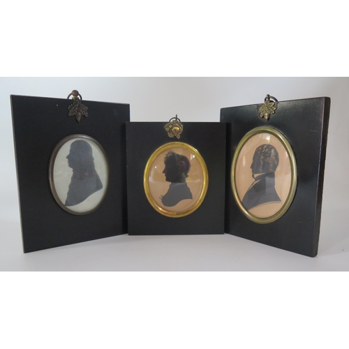 330 - A three Regency period silhouettes of a lady and two  gentleman,  contained in ebonised  frames, 9 x... 