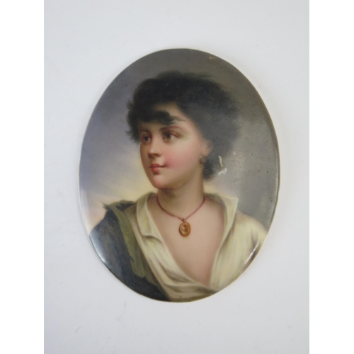 332 - A KPM style oval porcelain plaque, depicting a young gypsy boy with locket around his throat, 8.5cm ... 