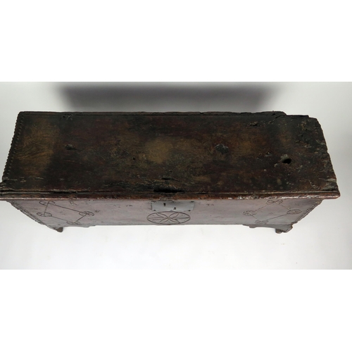 346 - A 17th century elm coffer, of rectangular outline, the hinged lid with moulded and chip carved edge,... 