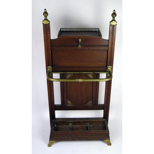 347 - A Victorian Schoolbred style oak stick stand, the rectangular back with brass finials, with single s... 