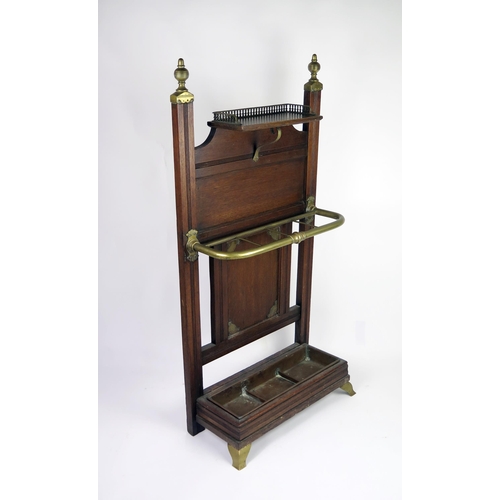 347 - A Victorian Schoolbred style oak stick stand, the rectangular back with brass finials, with single s... 