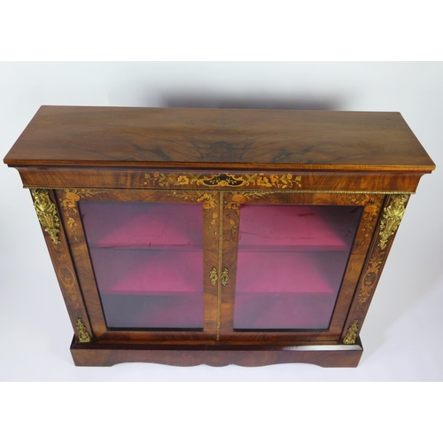 349 - A 19th century walnut, floral inlaid and gilt metal mounted pier cabinet, the rectangular top above ... 