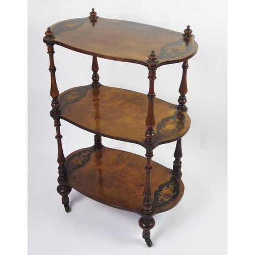 350 - A Victorian walnut and floral inlaid three-tier what not, of cartouche-shaped outline, on ring turne... 