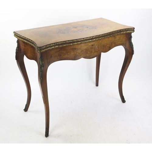 353 - A 19th century French walnut, marquetry and crossbanded card, of serpentine outline the hinged swive... 