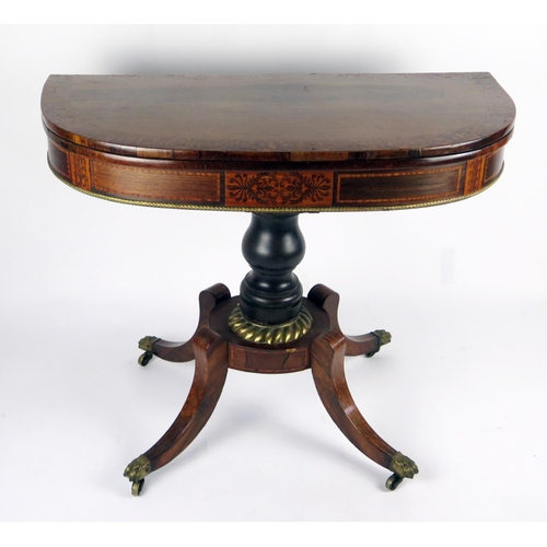 355 - A 19th century rosewood card table, the hinged crossbanded top of D-shaped outline with baize lined ... 