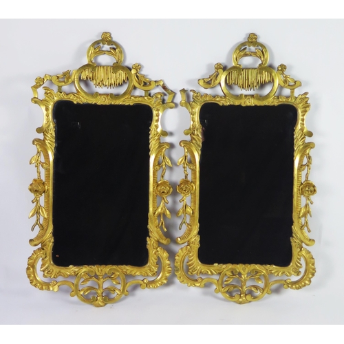 362 - A pair of late 18th century gilt wood wall mirrors of arched outline, with arched stalactite decorat... 