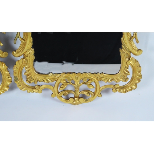 362 - A pair of late 18th century gilt wood wall mirrors of arched outline, with arched stalactite decorat... 