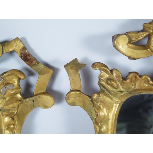 362 - A pair of late 18th century gilt wood wall mirrors of arched outline, with arched stalactite decorat... 