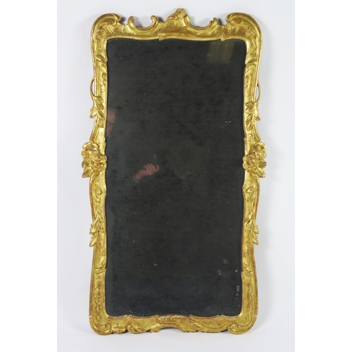 365 - A late 18th century gilt and gesso pier glass, the rectangular mirror plate enclosed by floral and f... 