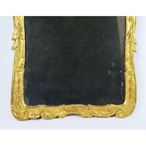 365 - A late 18th century gilt and gesso pier glass, the rectangular mirror plate enclosed by floral and f... 