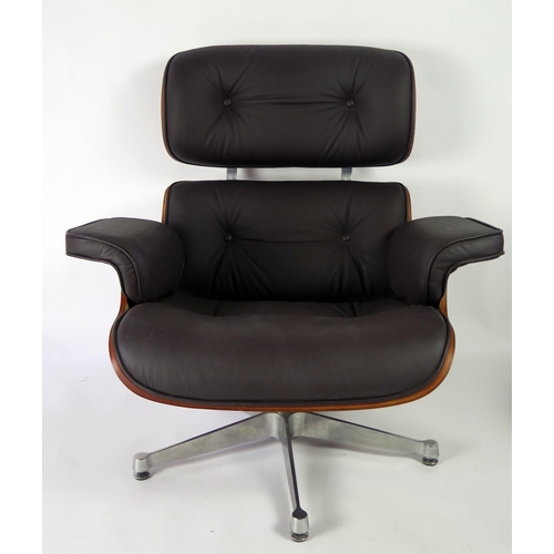 369 - An Eames style swivel armchair, with button down upholstered back and stuff over seat, with padded a... 