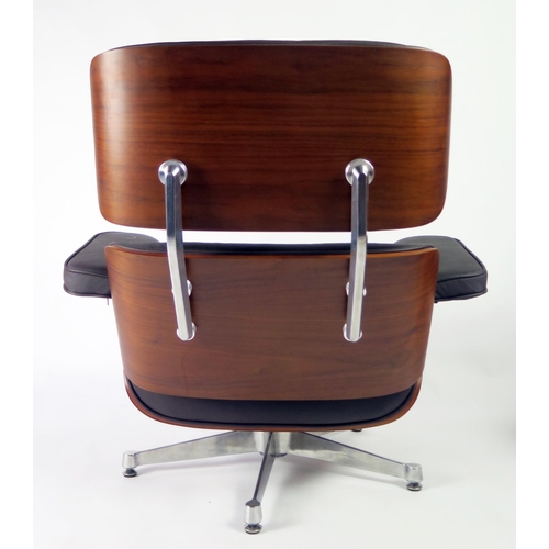 369 - An Eames style swivel armchair, with button down upholstered back and stuff over seat, with padded a... 