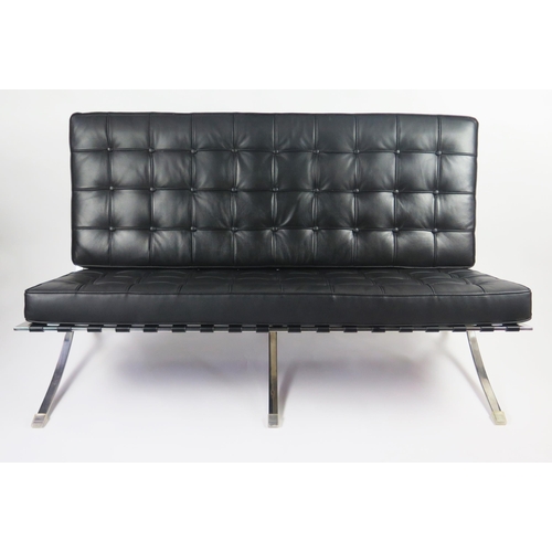 370 - A black Barcelona style sofa, with button down loose cushions, on a chrome X-frame with swept legs, ... 