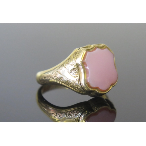 41 - A Victorian 15ct Gold 'Poison' Ring, the hinged top set with agate and opening to reveal a foliate c... 