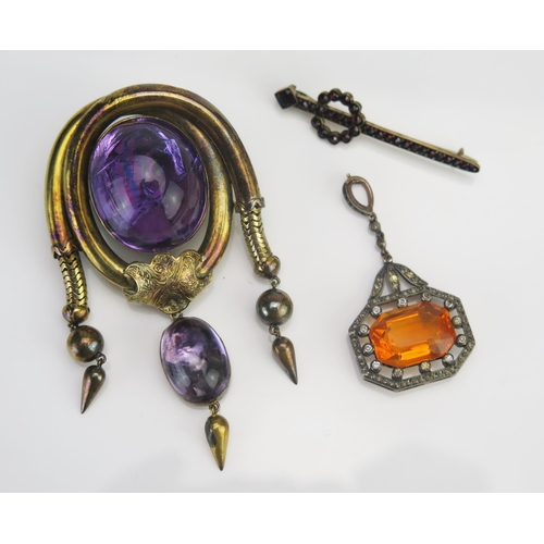 51 - A Victorian Pinchbeck and Foil Backed Cabochon Amethyst Locket Back Brooch, 76.6mm drop, 19th centur... 