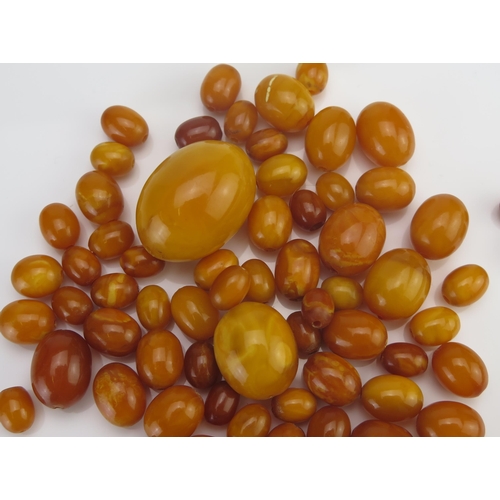 64 - A Quantity of Amber Graduated Loose Beads, largest 31x22.6mm, 58.79g