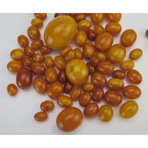 64 - A Quantity of Amber Graduated Loose Beads, largest 31x22.6mm, 58.79g