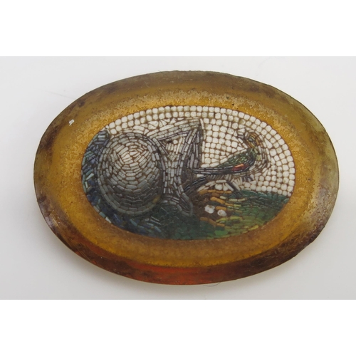 66 - An Antique Italian Micromosaic Panel depicting a nesting bird beside a helmet or cauldron, 24.9x17.8... 