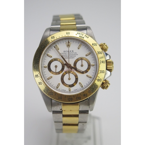 A Gent's ROLEX Daytona Oyster Perpetual Cosmograph, Ref: 16523, 1997, 38.6mm case no. T813026, calibre 4030 movement no. 125045, chronograph movement adjusted to five positions and temperature, inner case back no. 16500, white dial with luminous baton markers and red 'DAYTONA', sub dials for seconds, 30 minute and 12 hour registers, outer fifth of seconds track, case with a screw down protected crown, screw down buttons to operate the chronograph, Units Per Hour gold tachymeter bezel, Rolex Oyster Ref. 78393 steel and gold bracelet with 403 end links. Rolex wooden box and outer card box, guarantee paperwork dated 1st September 1997 calendar card for 1997/1998 in leather wallet with Oyster booklet, various other booklets, and swing tag, Rolex cotton handkerchief and suede travel watch protector. Bought from Alexanders jewellers with letters and insurance certificate dated 29th August 1997. Winds and runs and push buttons functioning