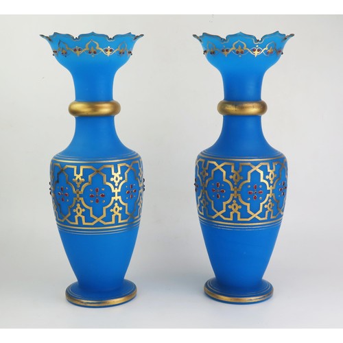 168 - A pair of 19th century blue glass vases with flared rims, ring necks and ovoid bodies, on a circular... 