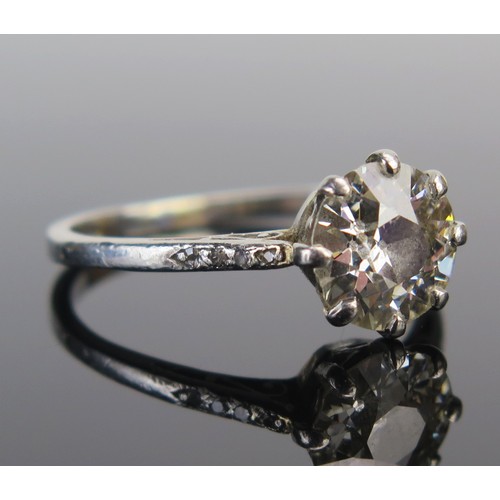 4 - A Diamond Solitaire Ring in a precious white metal setting, the c. 8.1mm old European cut stone in a... 